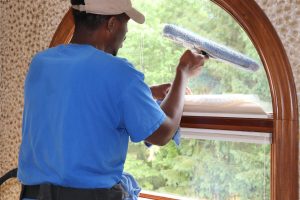 Charles Cleaning Bathroom Window