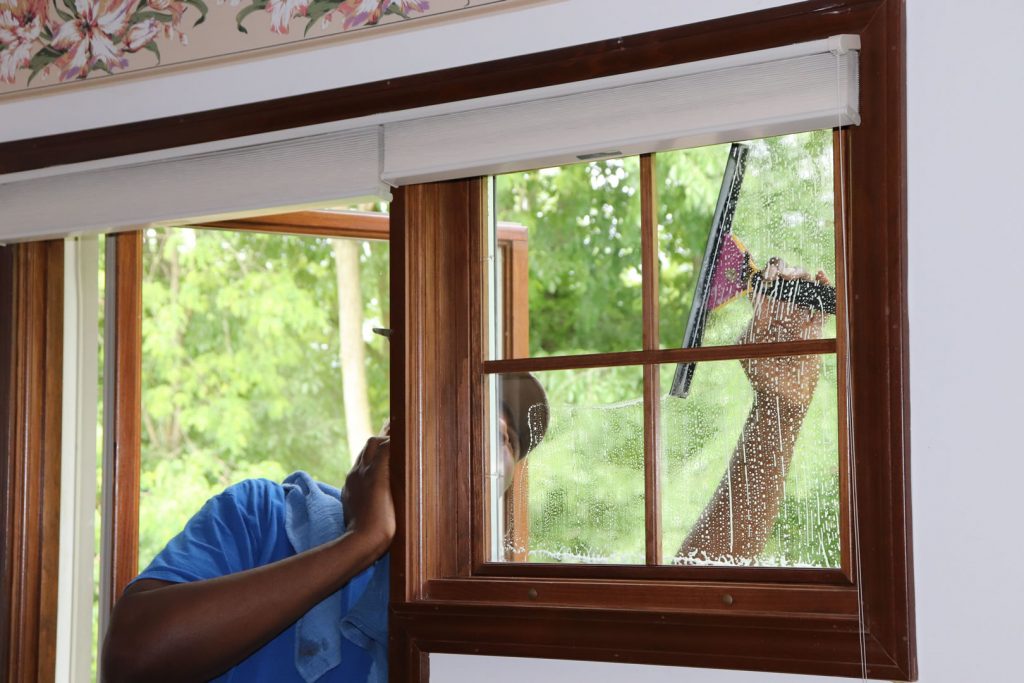 Charles Cleaning Bedroom Window